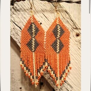 Beautiful beaded earrings, colors are rust, cream and gray.